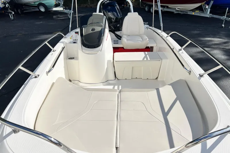 Slide: The Image of 2021 Boston Whaler 160 Super Sport boat interior with seating and steering console. - 4