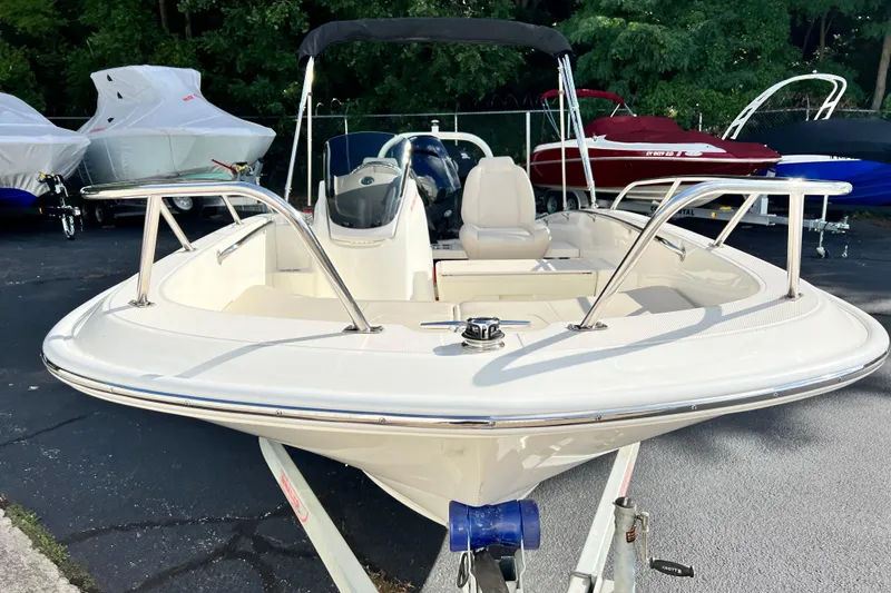 Slide: The Image of 2021 Boston Whaler 160 Super Sport boat on trailer, parked outdoors. - 5