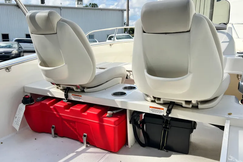 Slide: The Image of 2021 Boston Whaler 160 Super Sport interior with seats and red fuel tank. - 7