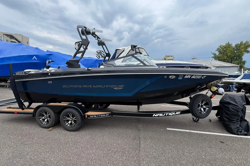 Slide: The Image of 2020 Nautique Super Air Nautique GS22 boat on trailer, parked outdoors. - 0