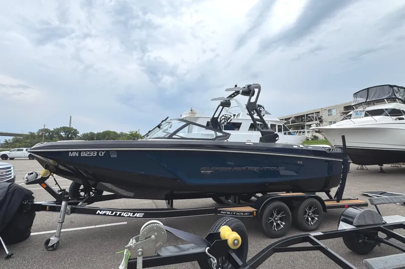 Slide: The Image of 2020 Nautique Super Air Nautique GS22 boat on trailer, parked outdoors. - 1