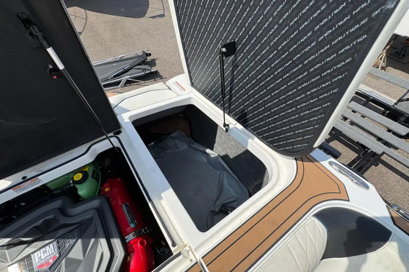 Slide: The Image of 2020 Nautique Super Air Nautique GS22 interior with white seating and wood-style flooring. - 12