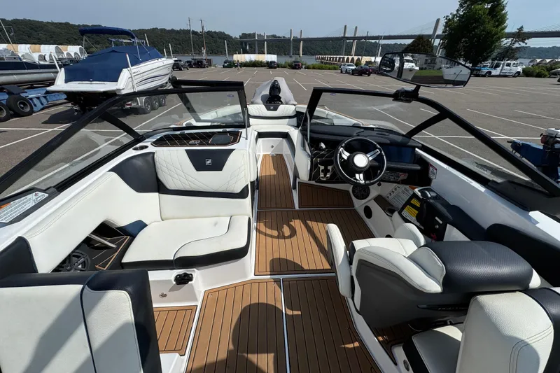 Slide: The Image of 2020 Nautique Super Air Nautique GS22 interior with JL Audio speaker and cup holders. - 29