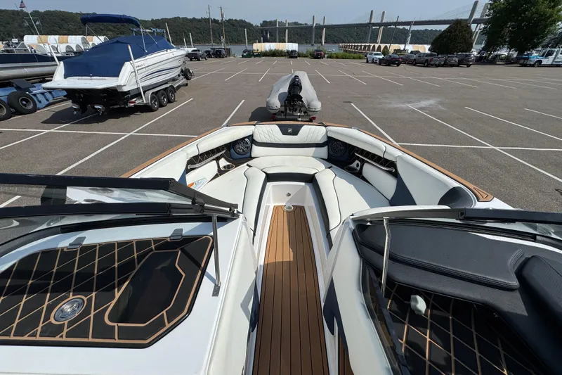 Slide: The Image of Control panel of 2020 Nautique Super Air Nautique GS22 boat, featuring various buttons and labels. - 32