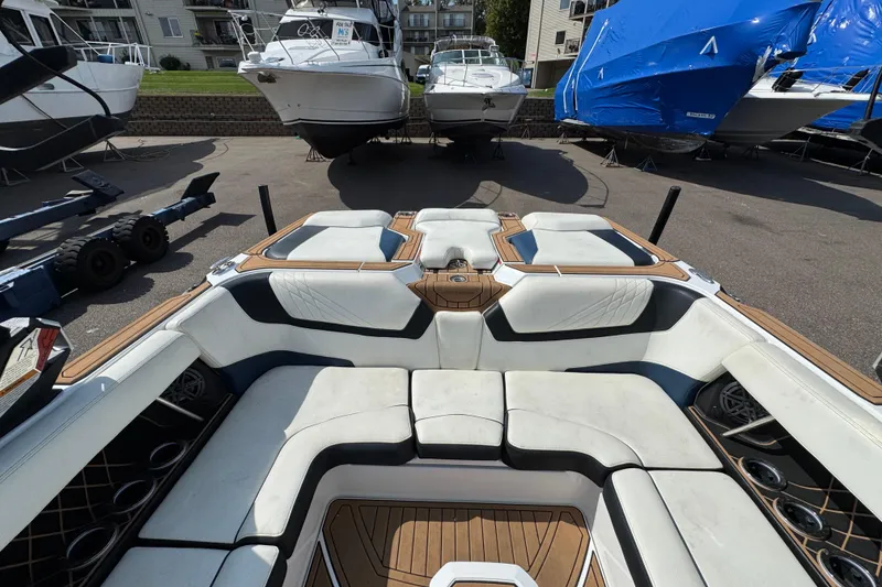 Slide: The Image of 2020 Nautique Super Air Nautique GS22 storage compartment with cover and equipment. - 36