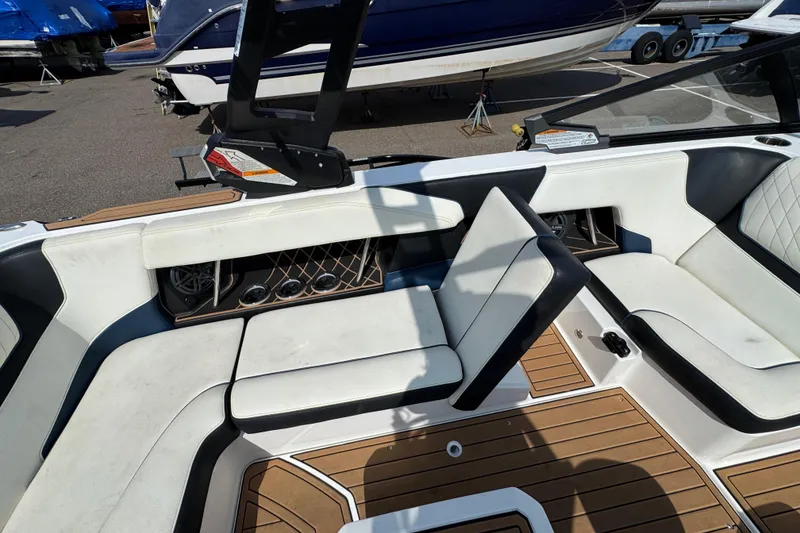 Slide: The Image of 2020 Nautique Super Air Nautique GS22 storage compartment with ballast bag and hose. - 37