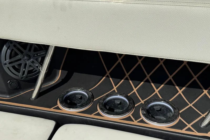 Slide: The Image of 2020 Nautique Super Air Nautique GS22 boat with covered vessels in the background. - 39