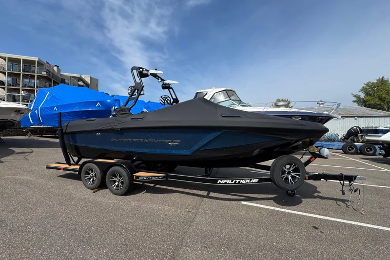 Slide: The Image of 2020 Nautique Super Air Nautique GS22 boat on trailer, parked in marina lot. - 4