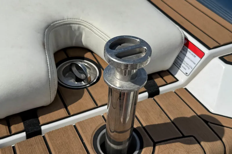 Slide: The Image of 2020 Nautique Super Air Nautique GS22 with blue covers in a parking lot. - 40