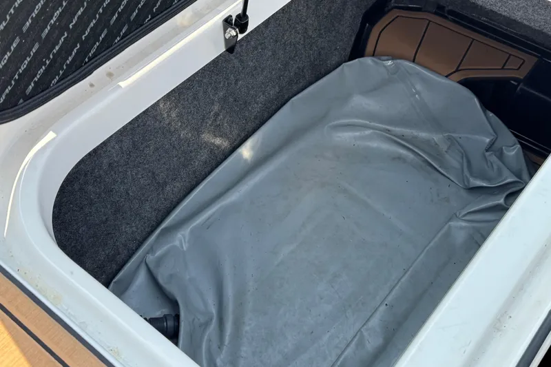 Slide: The Image of 2020 Nautique Super Air Nautique GS22 on trailer, showcasing sleek design and dual axles. - 43