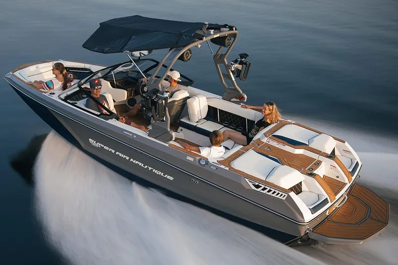 Slide: The Image of Manufacturer Provided Image: 2020 Nautique Super Air Nautique GS22 boat with passengers on a calm lake. - 48