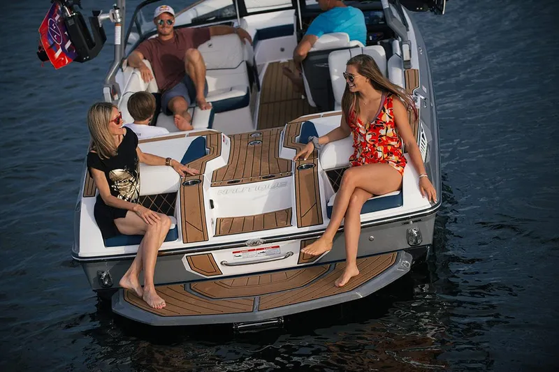 Slide: The Image of Manufacturer Provided Image: 2020 Nautique Super Air Nautique GS22 boat cruising with passengers on a lake. - 49