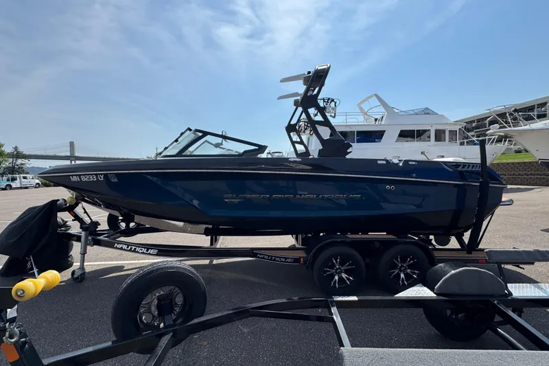 Slide: The Image of 2020 Nautique Super Air Nautique GS22 boat on trailer in parking lot. - 5