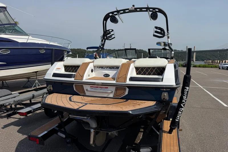 Slide: The Image of 2020 Nautique Super Air Nautique GS22 boat on trailer in parking lot. - 8