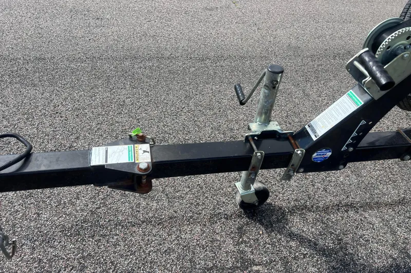 Slide: The Image of Trailer hitch and winch of 2011 Alumacraft Classic 165 CS on asphalt. - 10