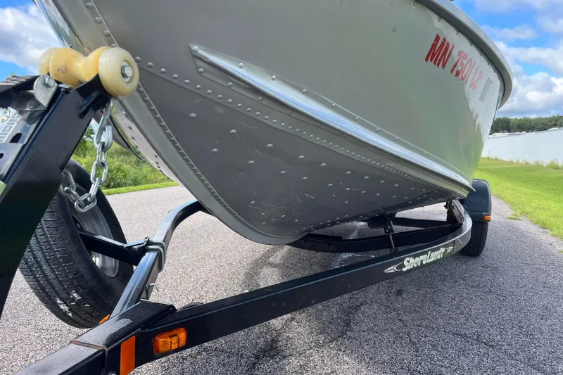 Slide: The Image of 2011 Alumacraft Classic 165 CS boat on ShoreLand'r trailer, parked on a paved road. - 11