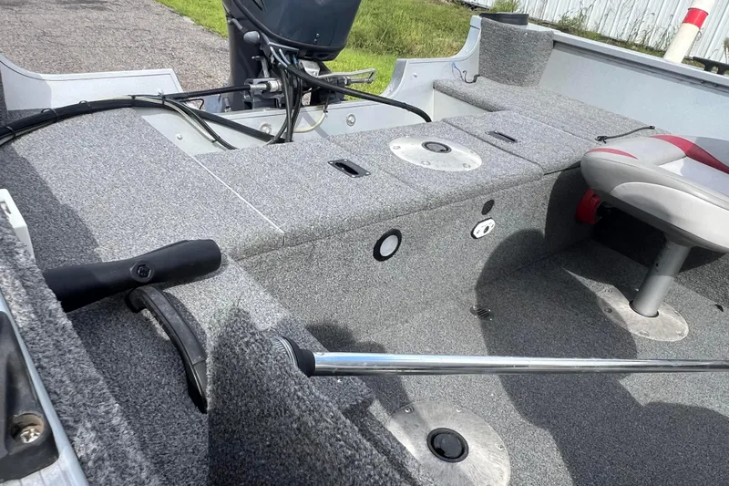 Slide: The Image of 2011 Alumacraft Classic 165 CS boat interior with seating and motor. - 26