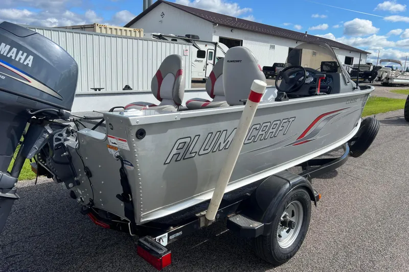 Slide: The Image of 2011 Alumacraft Classic 165 CS boat with Yamaha outboard motor on trailer. - 3