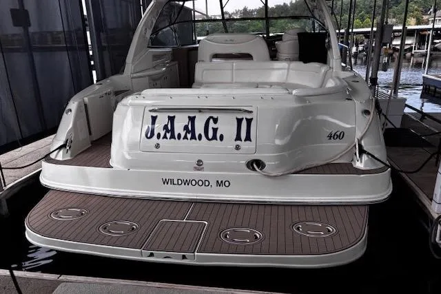 Slide: The Image of 2004 Sea Ray 460 Sundancer yacht docked, rear view, named "J.A.A.G II," Wildwood, MO. - 11
