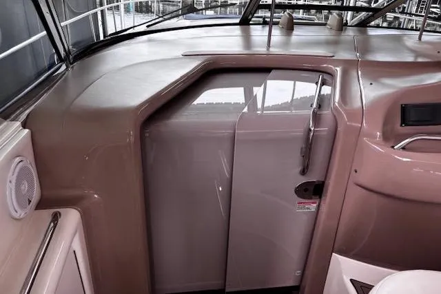 Slide: The Image of 2004 Sea Ray 460 Sundancer yacht interior with sleek dashboard and modern design. - 19