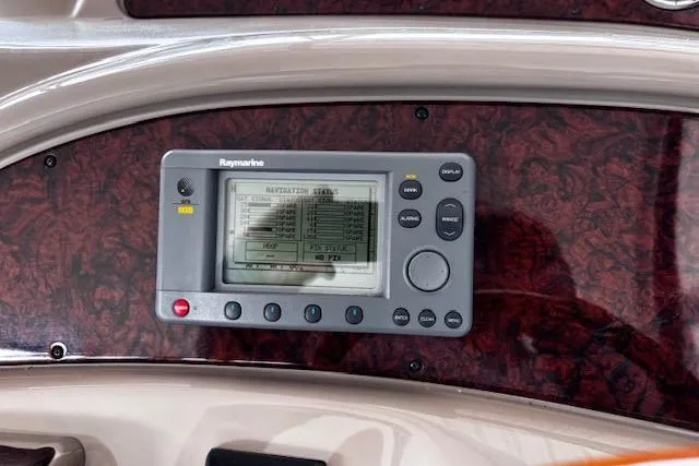 Slide: The Image of Raymarine navigation system on 2004 Sea Ray 460 Sundancer yacht dashboard. - 21