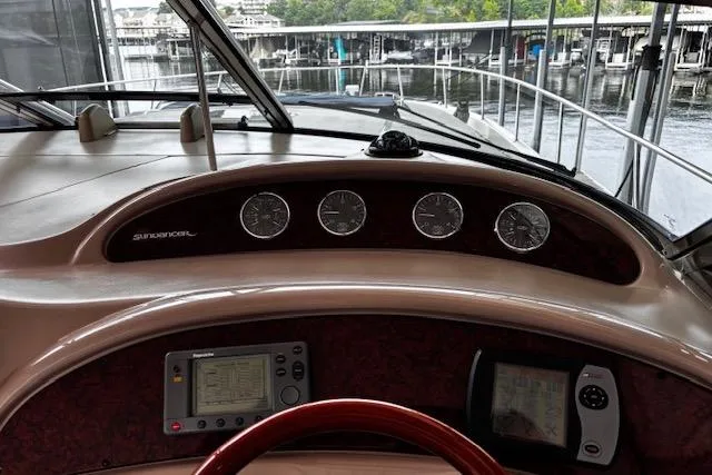 Slide: The Image of Dashboard of 2004 Sea Ray 460 Sundancer yacht with navigation instruments and gauges. - 25
