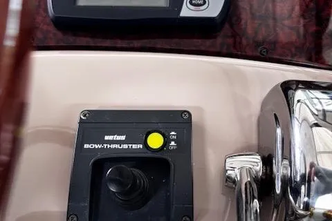 Slide: The Image of Control panel of a 2004 Sea Ray 460 Sundancer with bow thruster joystick. - 28