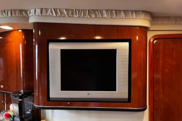 Slide: The Image of Flat-screen TV on 2004 Sea Ray 460 Sundancer yacht with wood paneling. - 40