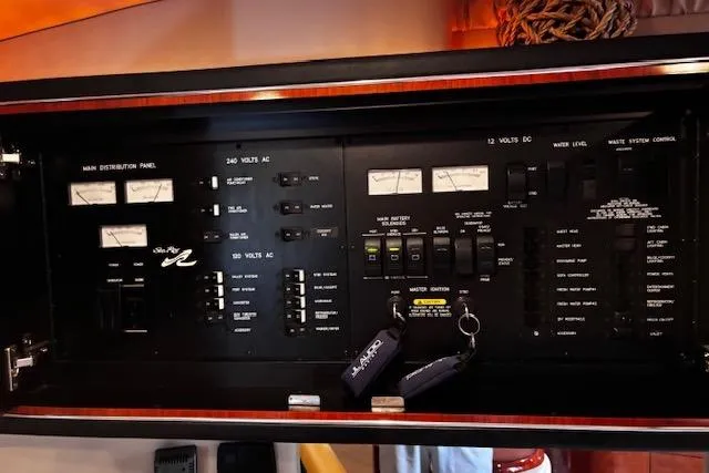 Slide: The Image of Electrical control panel of a 2004 Sea Ray 460 Sundancer yacht. - 51