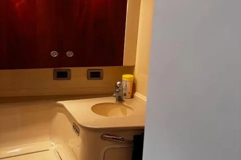 Slide: The Image of Bathroom interior of 2004 Sea Ray 460 Sundancer yacht with sink and storage. - 55