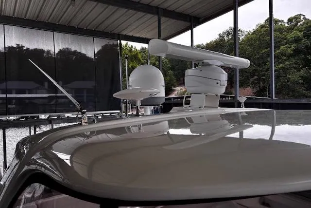 Slide: The Image of 2004 Sea Ray 460 Sundancer yacht with radar equipment under covered dock. - 7