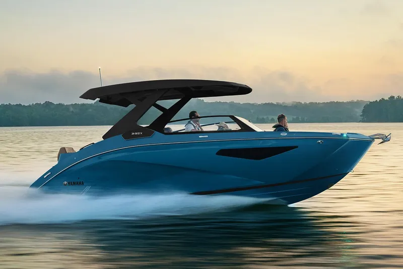 The Image of Manufacturer Provided Image: 2026 Yamaha Boats 295XD cruising on a serene lake at sunset. - 0