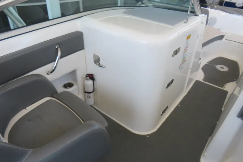 Slide: The Image of 2011 Sea Ray 240 Sundeck interior with seating, storage, and safety equipment. - 4