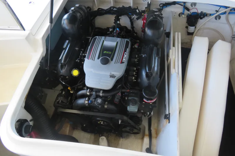 Slide: The Image of 2011 Sea Ray 240 Sundeck engine compartment with 350 MAG engine. - 7