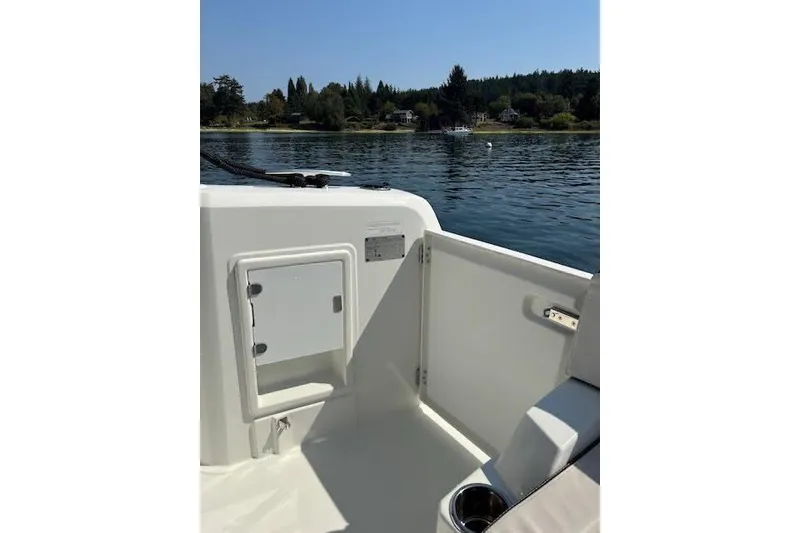 Slide: The Image of 2019 Jeanneau Velasco 37F boat interior with open hatch, scenic water view. - 13