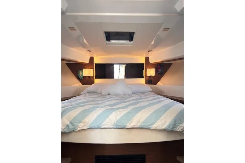Slide: The Image of Interior cabin of 2019 Jeanneau Velasco 37F with cozy bed and modern lighting. - 26