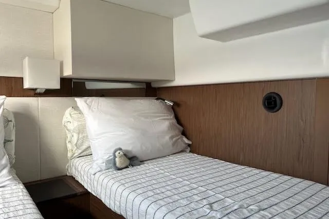 Slide: The Image of Cozy cabin interior of 2019 Jeanneau Velasco 37F with twin beds and plush bedding. - 30