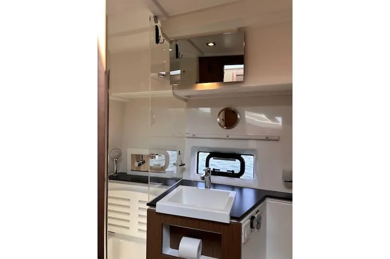 Slide: The Image of 2019 Jeanneau Velasco 37F yacht bathroom with modern sink and mirror. - 32