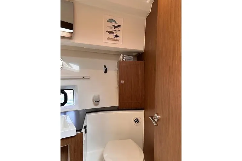 Slide: The Image of Bathroom interior of 2019 Jeanneau Velasco 37F yacht, featuring modern fixtures and wood accents. - 33