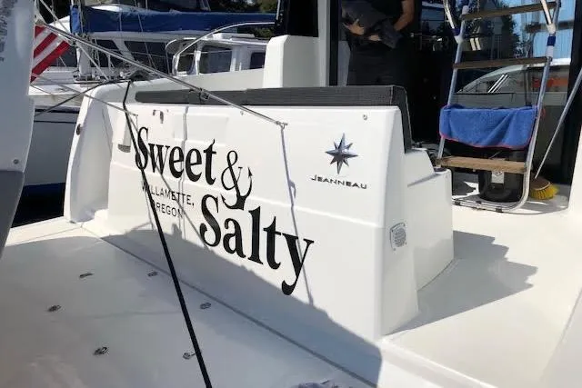 Slide: The Image of 2019 Jeanneau Velasco 37F boat with "Sweet & Salty" name, docked in Willamette, Oregon. - 4