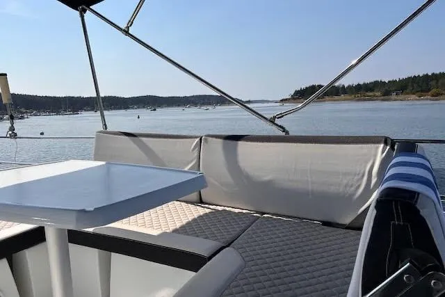 Slide: The Image of Flybridge seating area on 2019 Jeanneau Velasco 37F yacht with scenic water view. - 41