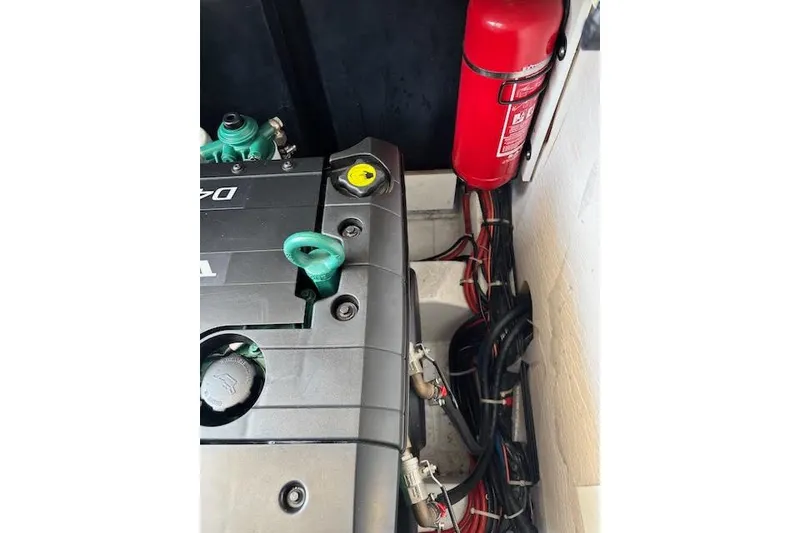 Slide: The Image of Engine compartment of 2019 Jeanneau Velasco 37F with fire extinguisher and wiring. - 47