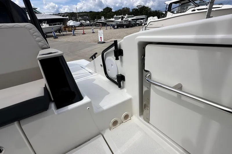 Slide: The Image of 2025 Navan C30 boat with dual Mercury engines and cushioned seating. - 10