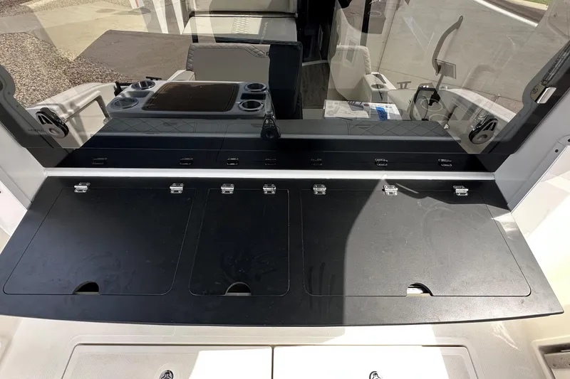 Slide: The Image of 2025 Navan C30 boat interior with seating and table, featuring cup holders and storage. - 15