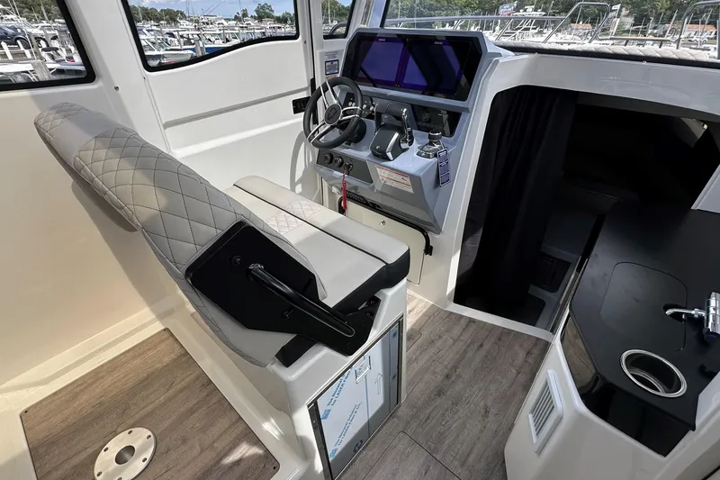Slide: The Image of 2025 Navan C30 boat kitchen with sink and grill setup. - 21