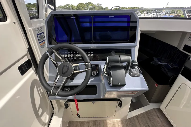 Slide: The Image of Interior of 2025 Navan C30 boat with modern helm and seating. - 28