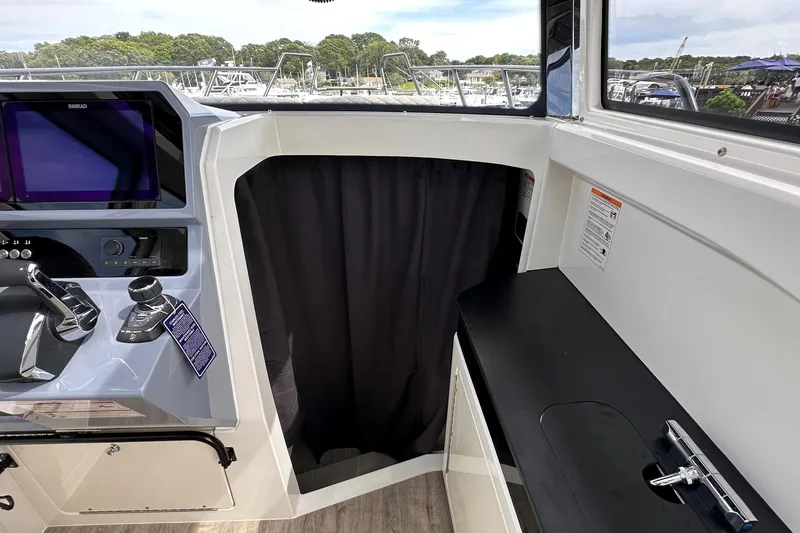 Slide: The Image of Interior view of 2025 Navan C30 boat with open hatch and visible wiring. - 32
