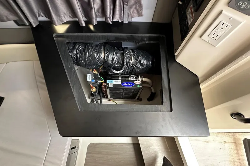 Slide: The Image of Control panel of 2025 Navan C30 boat with SmartCraft diagnostics and Johnson pump. - 33