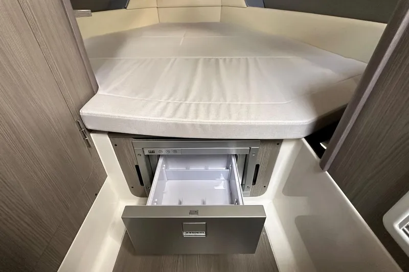 Slide: The Image of 2025 Navan C30 boat interior with control panel and scenic marina view. - 36