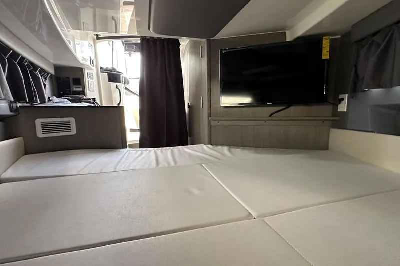 Slide: The Image of Interior of 2025 Navan C30 RV with bed and mounted TV. - 45